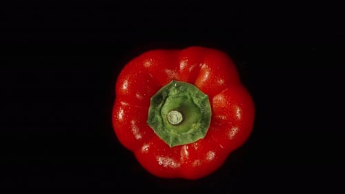Bulgarian Red Pepper Top View. Rotation on a black background. Isolate.