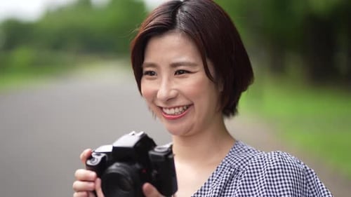 Woman Photographer Taking Pictures Outside