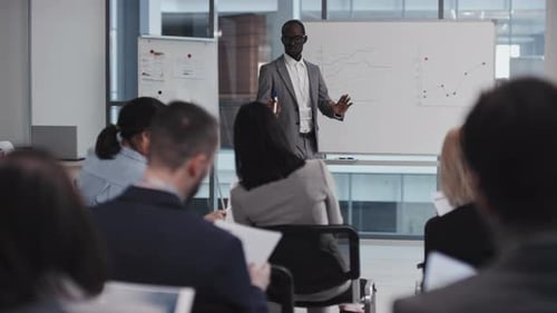 Man Giving Business Presentation to an Audience