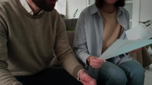 Couple Reviewing Documents Together at Home