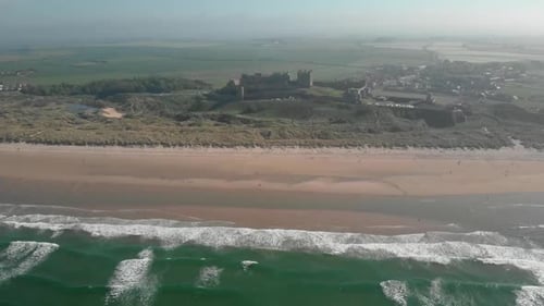 Aerial view of a castle on the beach in Scotland
