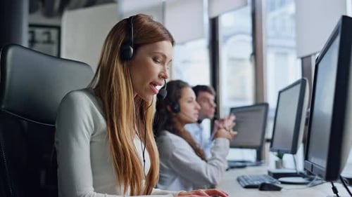 Beautiful Operator Helping Client in Office. Professional Sales Manager Talking Client In