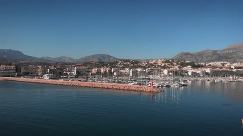 Port with moored white yachts