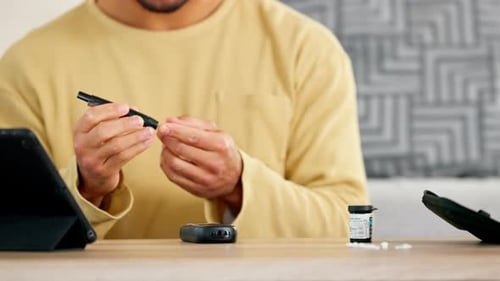 Adult Testing Blood Sugar with Lancing Device