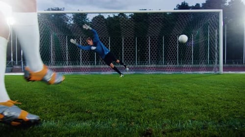 Soccer Goalie Blocks a Shot at Night