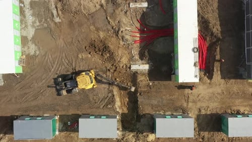 Aerial View of Industrial Construction Site with Excavator