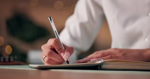 Hand Writing in Notebook with Pen Close Up