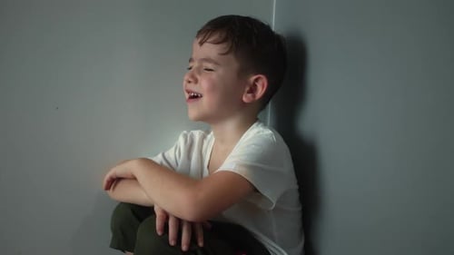 Child Punished Sitting Crying in the Corner