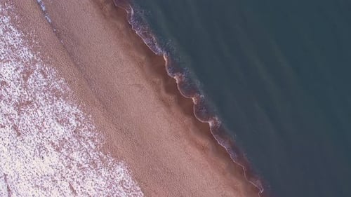 Winter in Cold Baltic Sea Snowy Beach in Gdansk Aerial View of Snow Covered Beach and Dunes Dark