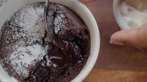 Scooping piece out of chocolate lava cake
