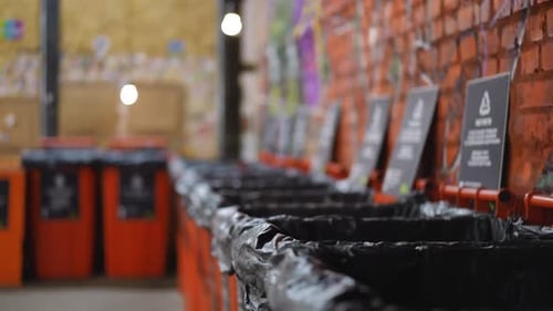 Rows of Garbage Bins for Different Types of Trash at Recycle Station Indoors No People on Factory