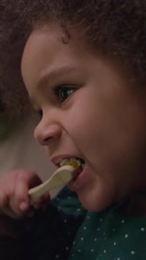 Girl Using Toothbrush with Toothpaste