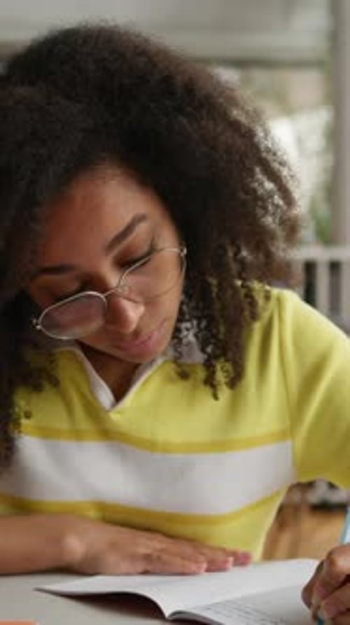 Concentrated African American Student Girl Writing Homework Puzzled Thinking Problem Solution Woman