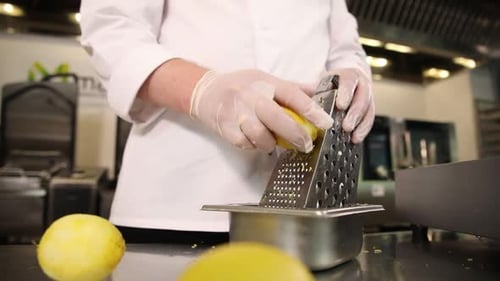 Chef Grating Lemon in Commercial Kitchen