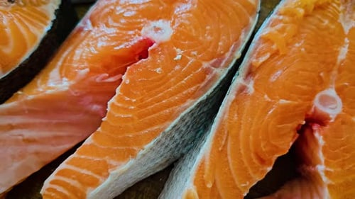 Close up dolly shot of fresh salmon steaks