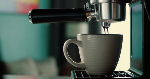 Pouring Coffee Stream From Machine Into Cup Fresh Espresso Brewing with Filter Holder Morning Ritual