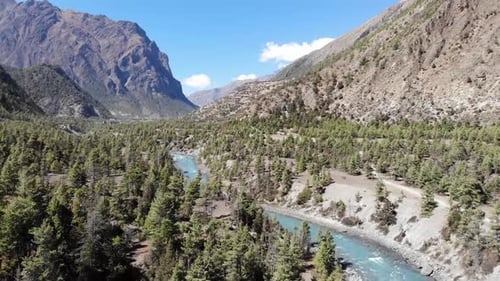 Narrow Waterscape Of Marsyangdi River Valley Within Annapurna Circuit In Central Nepal. aerial
