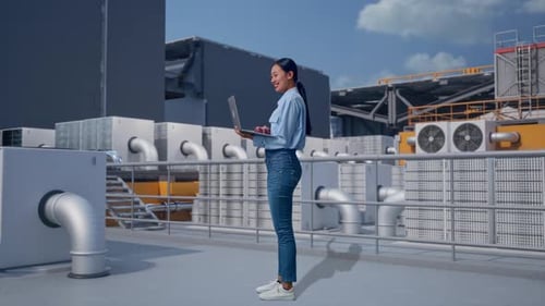Woman Stands with Laptop near Industrial Air Conditioning Units
