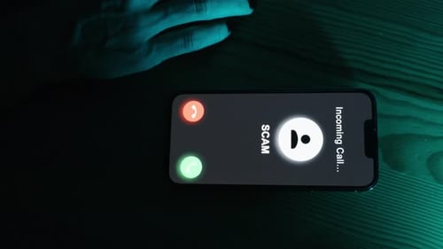 Rejecting a Scam Call on Smartphone at Night