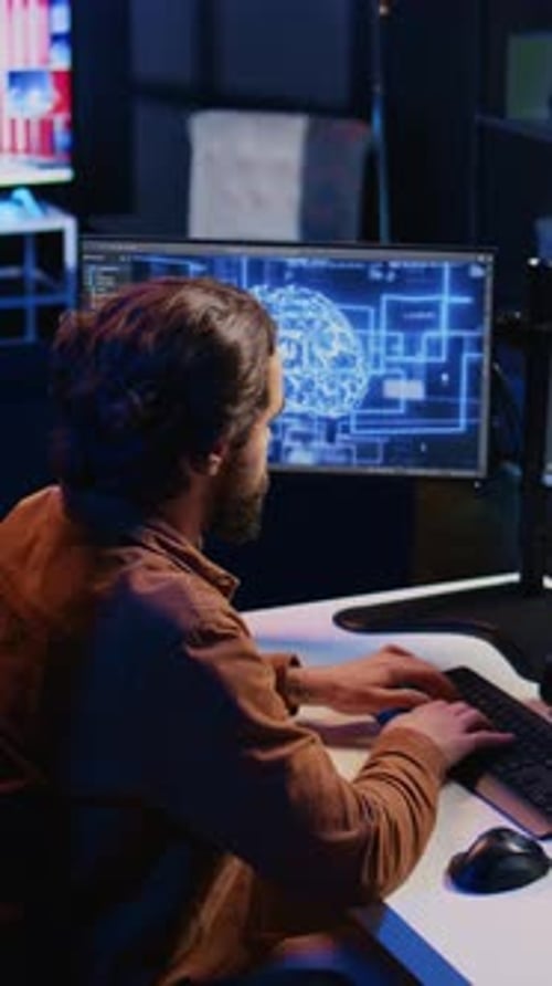 Freelancing Programmer Writes Artificial Intelligence Code on Desktop PC