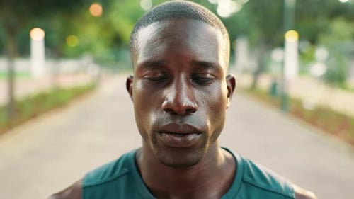 Tired, runner or face of black man in park for fitness training, workout or sports exercise