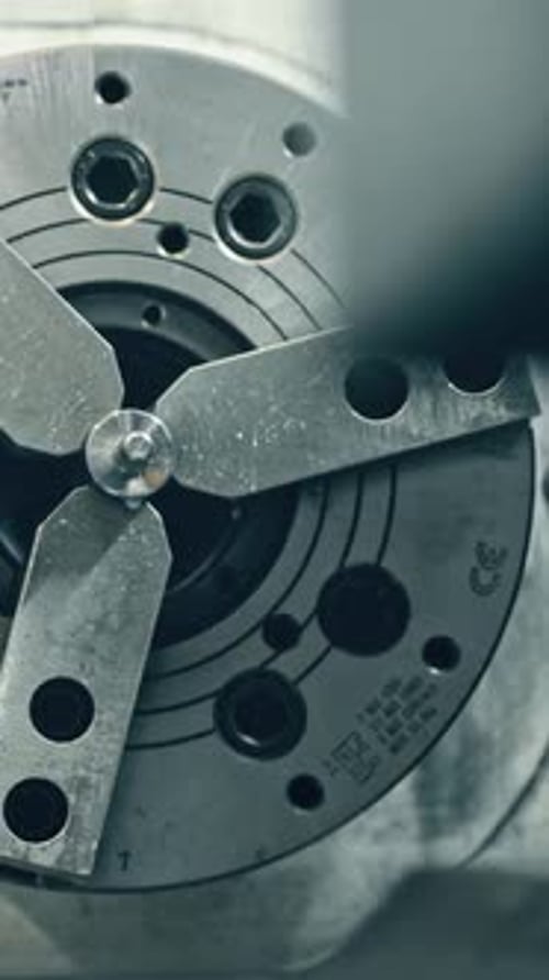 Metal lathe machine in action at precision engineering workshop