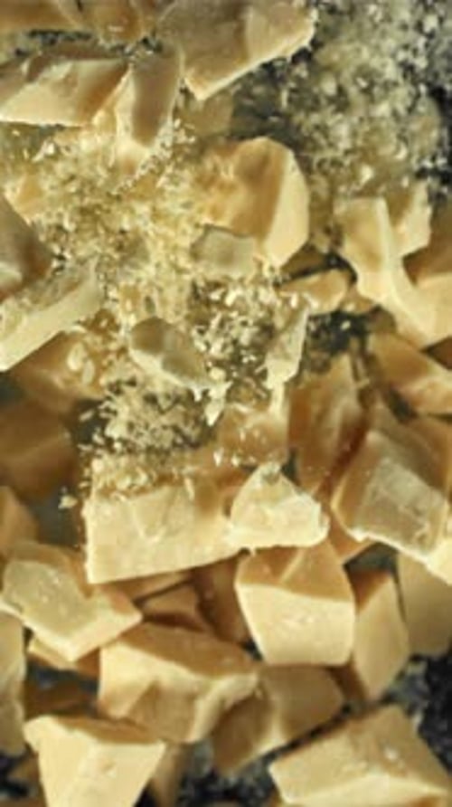 Pieces of White Chocolate Fly Up and Fall Down Filmed on a Highspeed Camera at 1000 Fps