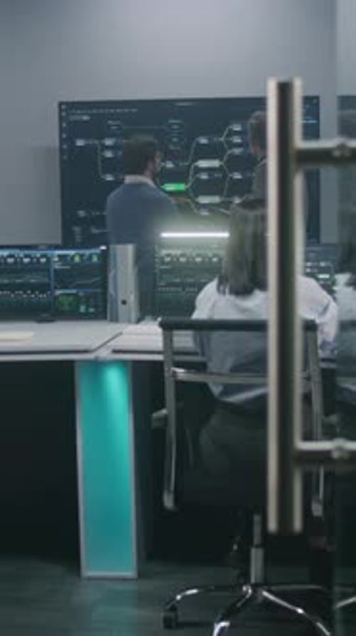 Multicultural Big Data Specialists Analyze Charts