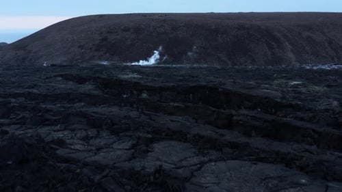 Sharp rugged black solid lava field in Fagradalsfjall valley, aerial