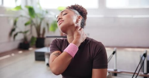 Woman, neck pain and injury with fitness at gym for muscle tension, sprain