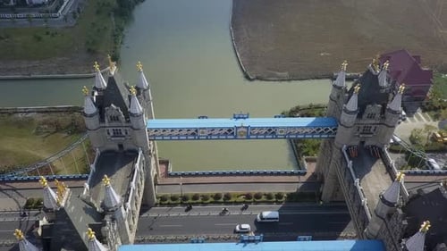 Low flyover tilts down to traffic below replica Tower Bridge in China