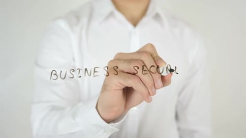 Hand Writing Business Security on Glass Surface