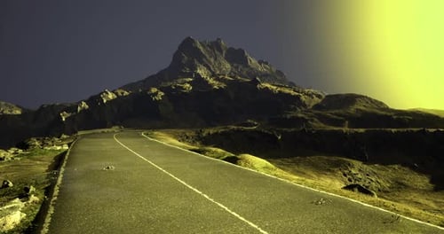 Scenic Road Leading Towards a Mountain Under a Surreal Yellow Sky at Dusk