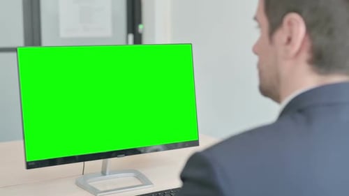 Businessman Working on Computer with Green Screen