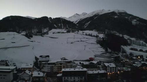 Skiing slopes and winter town of Solden, aerial drone view