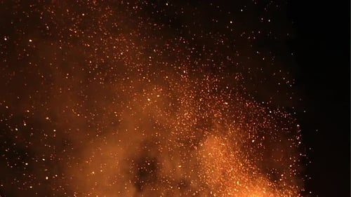 Sparks and Flakes of Fire in Darkness