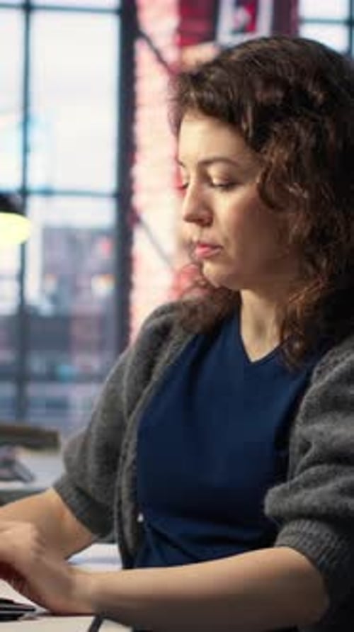 Vertical Video IT Female Technician Uses Coding Language on Computer at the Agency