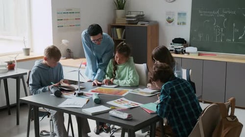 Teacher and Children Studying Wind Turbine Model in Class