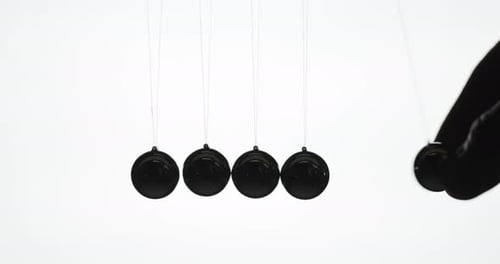 Newton's Cradle Kinetic Energy Experiment with Hand