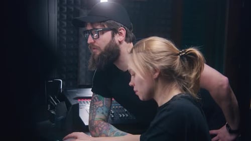 Female Sound Engineer Uses Mixing Console Creates Song with Producer