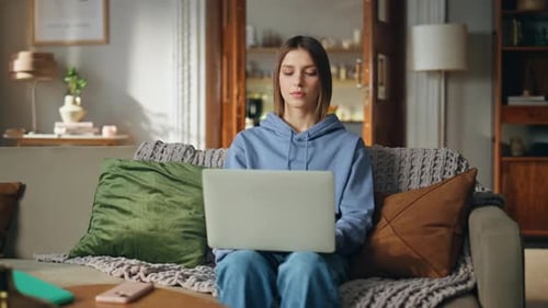 Woman Working on Laptop at Home