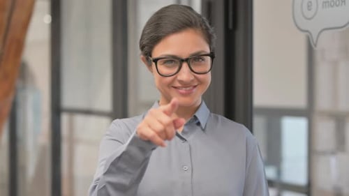 Portrait of Inviting Young Indian Businesswoman at Workplace