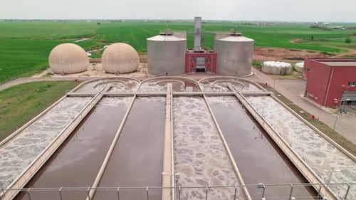 Aerial Drone View of Modern Water Treatment Plant in Green Valley, Clean Environment Concept