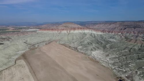 Aerial View of Layered Mountains and Desert Landscape