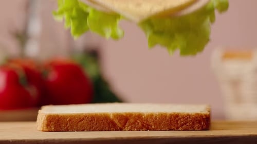Making a Sandwich with Lettuce and Cheese