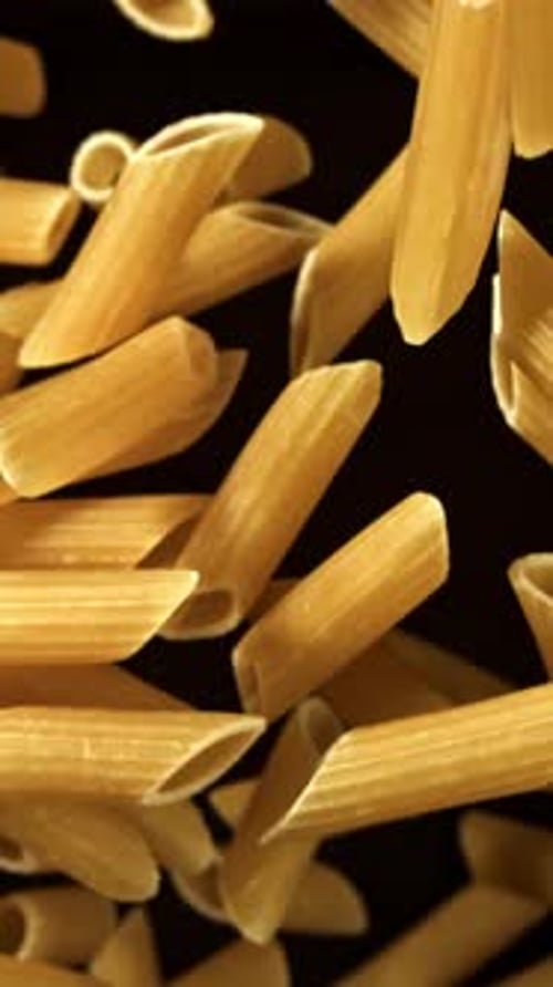 Super Slow Motion Flying Dry Penne Pasta Filmed on a Highspeed Camera at 1000 Fps