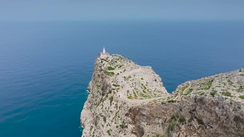 Rugged cliff with lighthouse tower