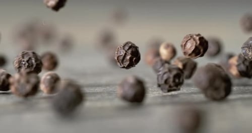 Peppercorns or black pepper spice. Super Macro Close Up. Shot on super slow motion camera 1000 fps.
