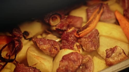 Roast Meat and Vegetables Baking in Pan