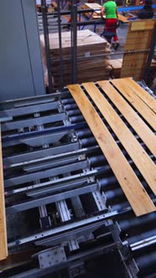 Process of making parquet boards indoors. Modern industrial factory for producing wooden laminate